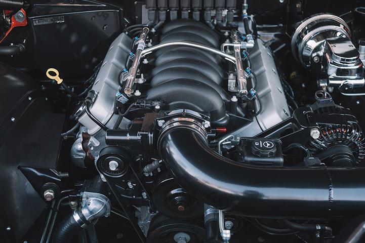 close-up of red sportscar black engine