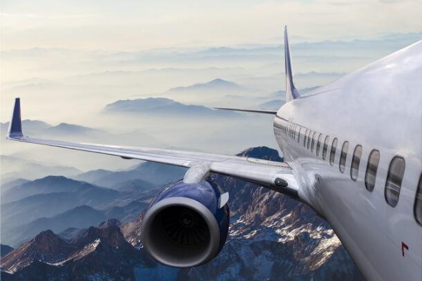 Passenger airplane flying through the sky, highlighting Viton™’s role in aerospace and high-performance sealing solutions